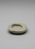 Small ceramic dish on a plain background