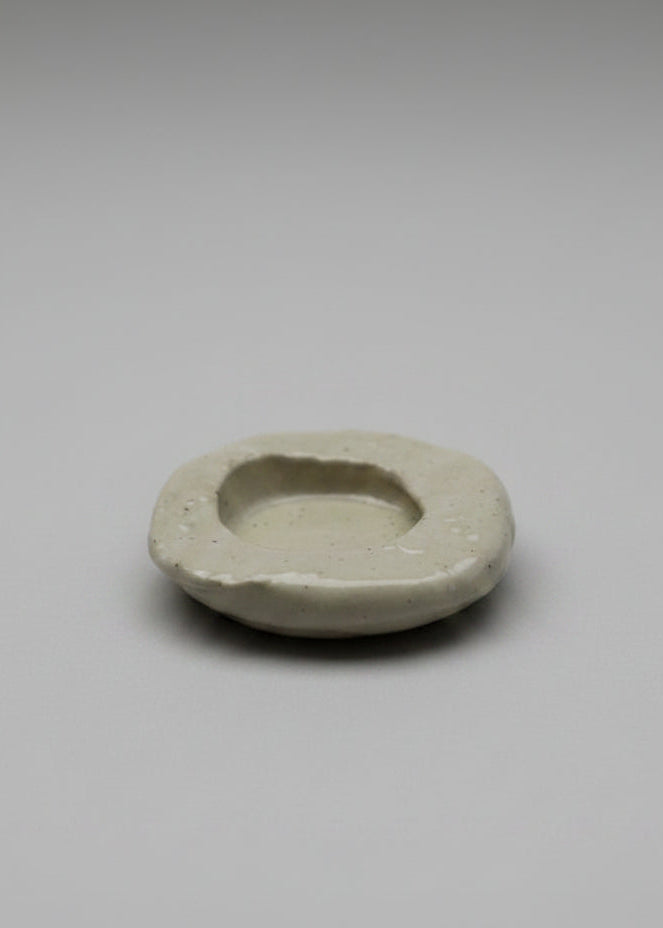 Small ceramic dish on a plain background