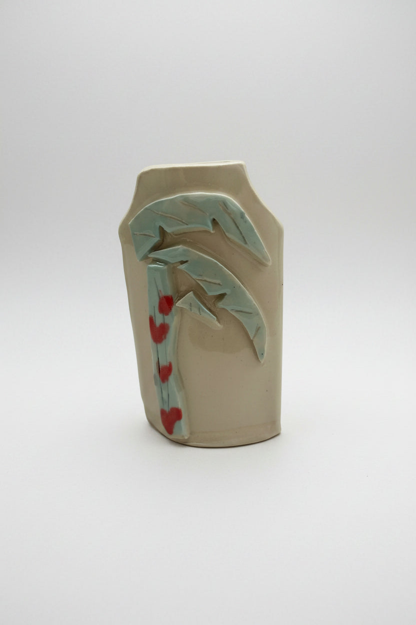 Ceramic vase with abstract design on a neutral background